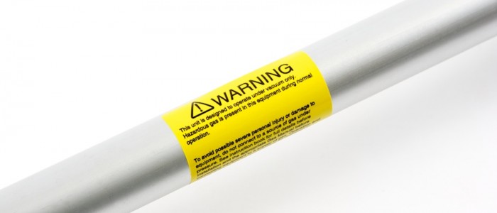 Warning label attached to a metal pole